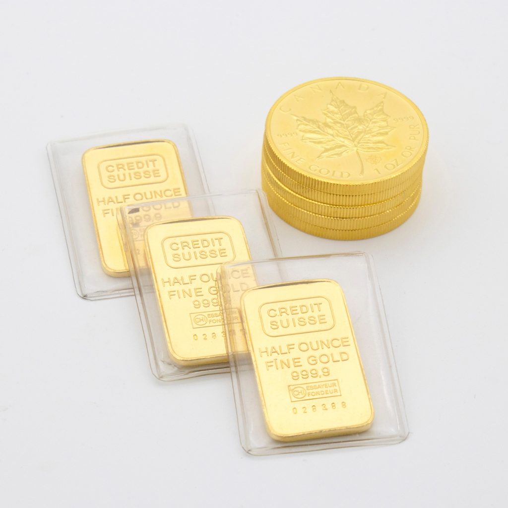 monete e lingotti d'oro